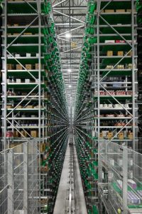 An automation project managed by Witron has halved the workforce and cut truck trips in half for a grocery wholesale operation.