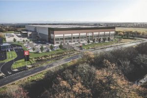 Cummins’ new 282,000 sq ft warehouse and distribution facility in Darlington has reached a key milestone, with the first structural steel going up and a steel signing ceremony held with contractor GMI Construction Group.